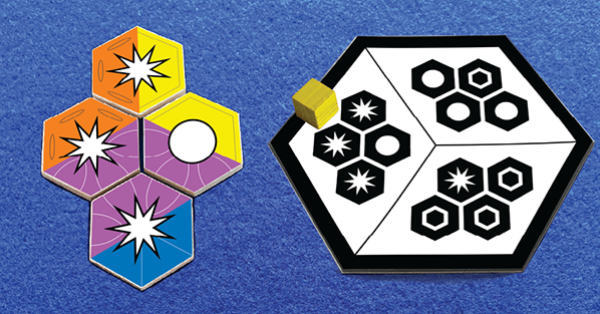 Colorful hexagonal tiles pushed together to solve a black and white puzzle.