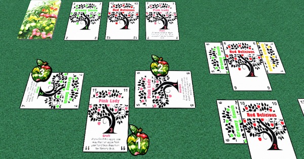 Numbered playing cards with trees on them are both vertical and horizontal on the table to make an orchard
