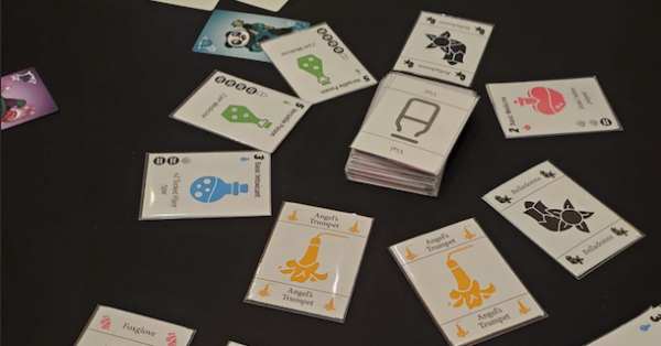 A circle of cards around a central deck