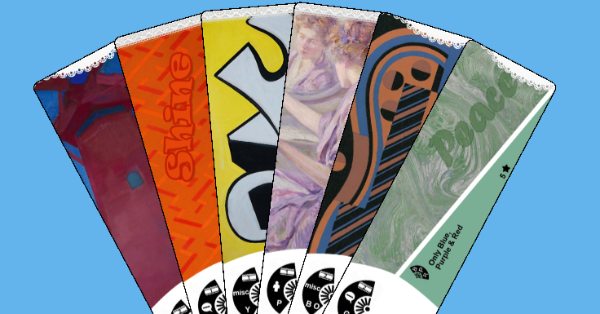 Long cards laid out to form a hand fan. Art on the cards is fine art paintings.