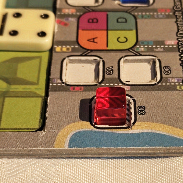 Closeup of an early prototype board with shiny cube and pretty zebra pattern distortion