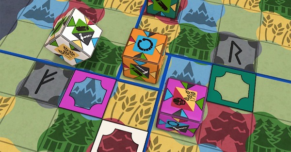 Game board with pieces being moved by players.  Large cubes on a map of a landscape, divided by a grid
