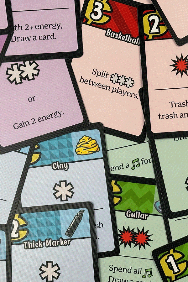 A photograph of the different character cards spread out on a table.